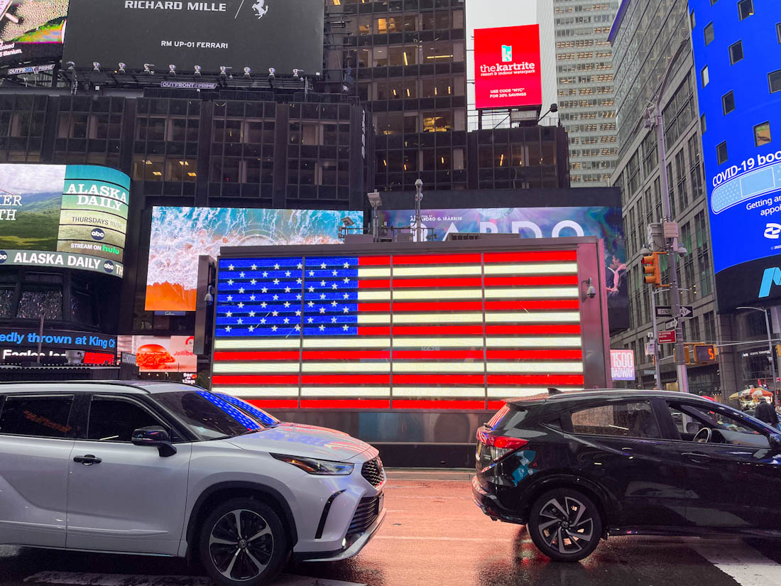 Cars US flag Times Square NYC New York