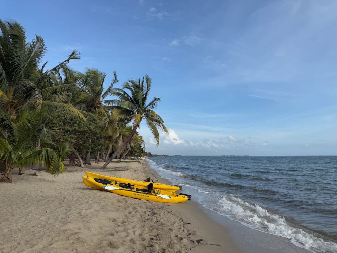 Gorgeous beach with yellow kayak at Hopkins Belize