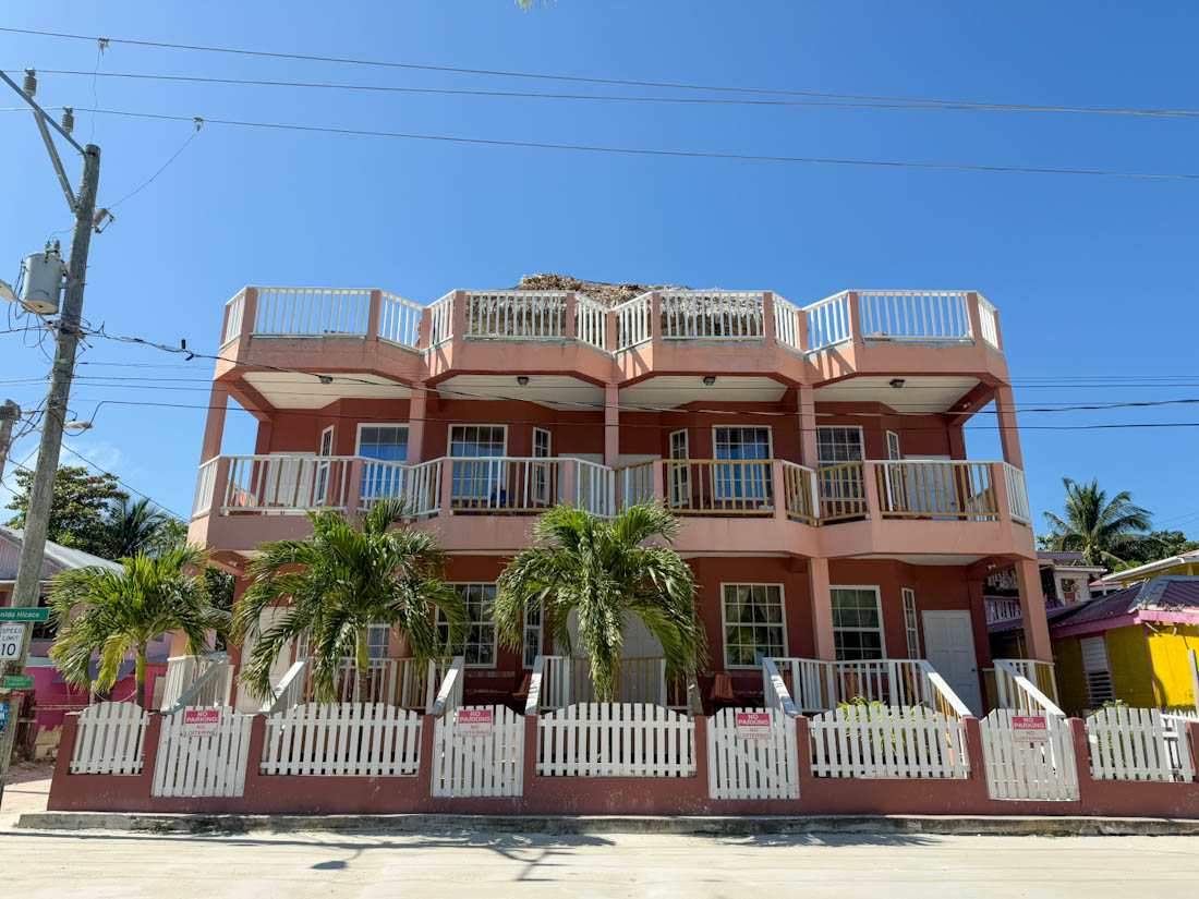 Caye Caulker Condos pink building in Belize