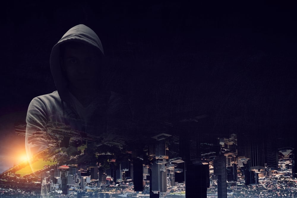 shutterstock 2069544902 | Two Scots Abroad man in hoodie at night