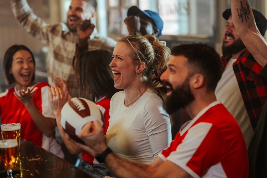 shutterstock 2730411971 | Two Scots Abroad belfast cheering at bar