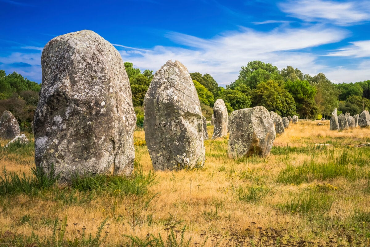 Carnac Stones France shutterstock 1552634948 | These Mysterious Stone Circles Might Be Even More Fascinating Than Stonehenge
