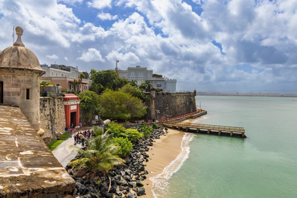Explore the scenic view of Old San Juan's historic coastal fortifications by the sea.