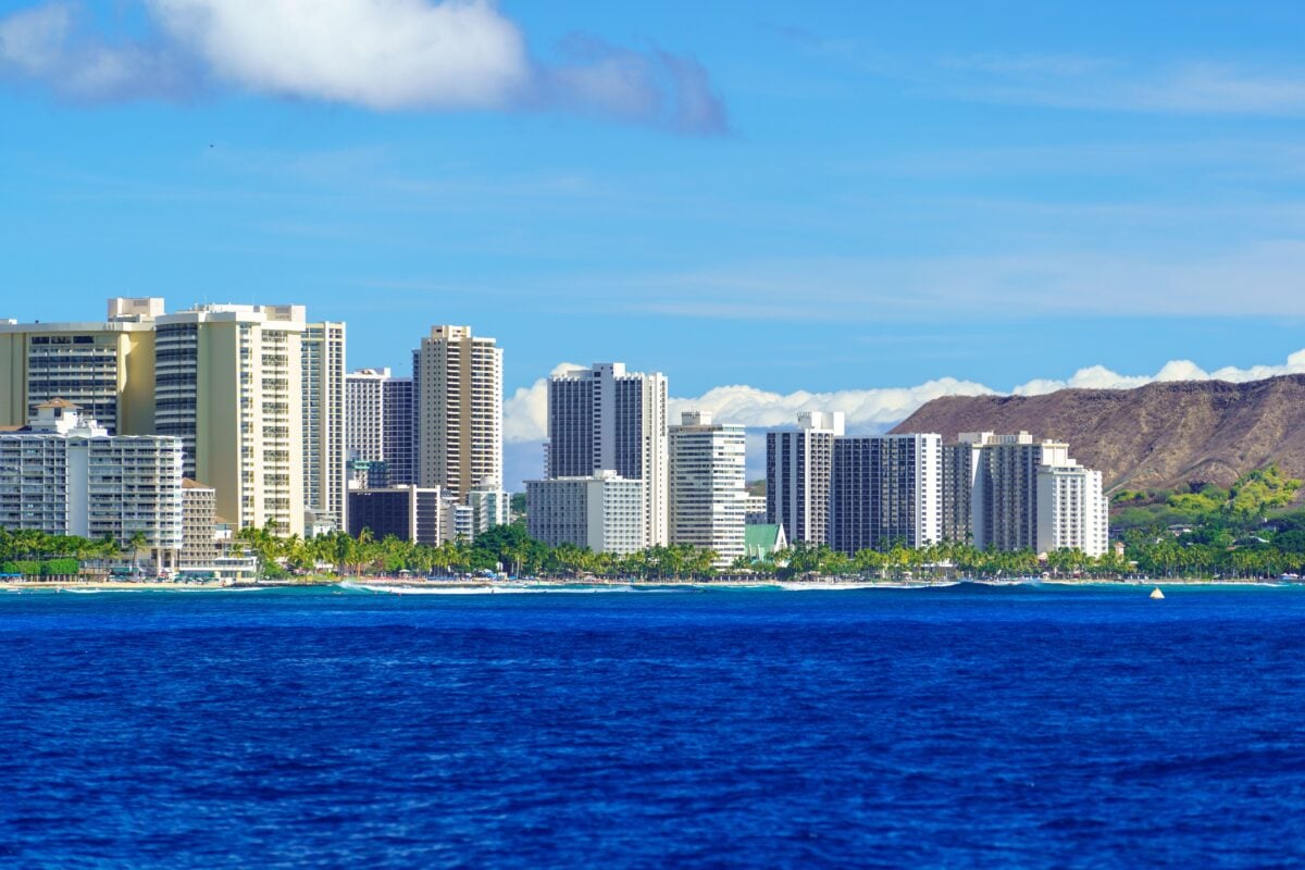 Stunning view of Honolulu skyline with Diamond Head crater and ocean.
