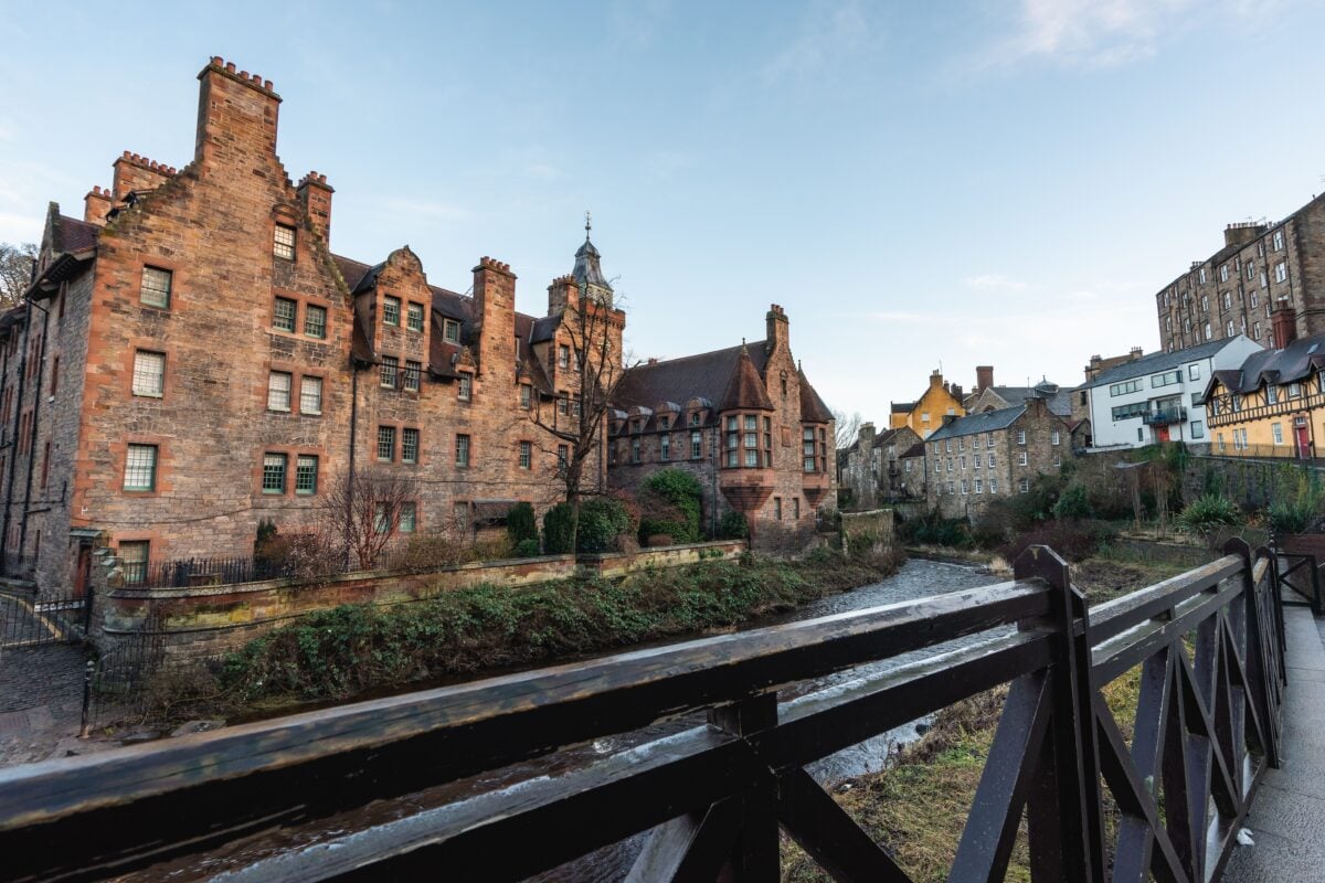Explore the iconic Gothic-style buildings along the Water of Leith in Edinburgh, Scotland.