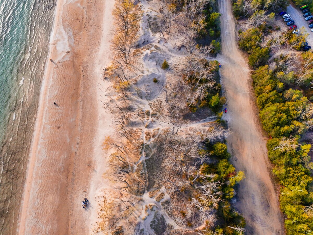 pexels 37648808 | Two Scots Abroad Stunning aerial view of a beach in Ontario, Canada showing a sandy shore and dense forest.