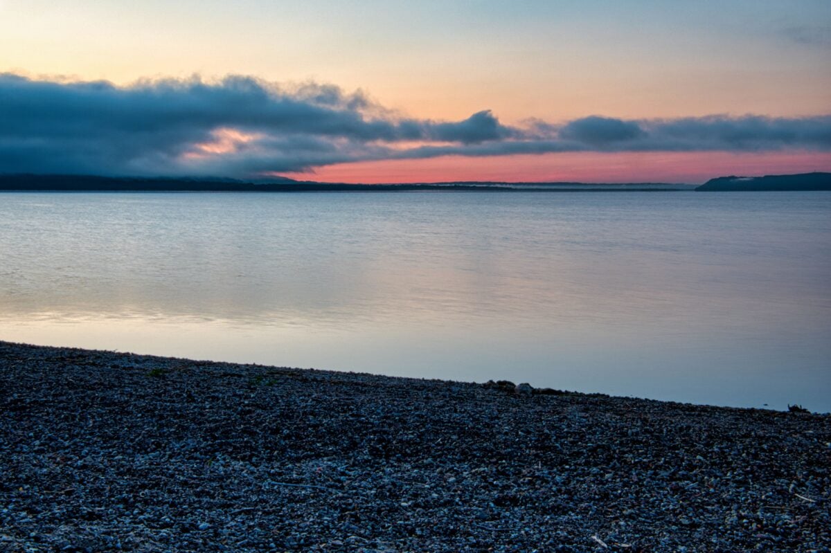 Beautiful sunrise over Lake Pepin, Minnesota with serene waters and colorful clouds.