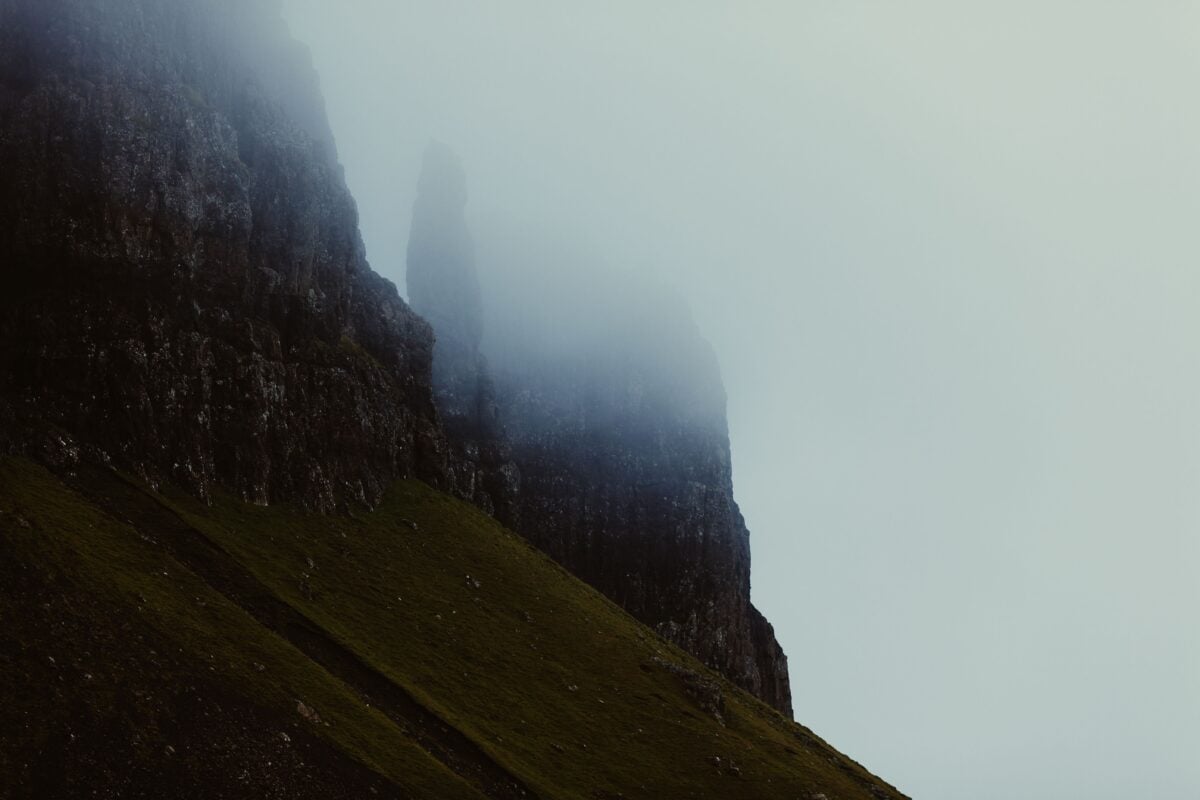 pexels 1803 | Two Scots Abroad Dramatic fog enveloping the rugged cliffs of Scotland, creating a mysterious and serene landscape.
