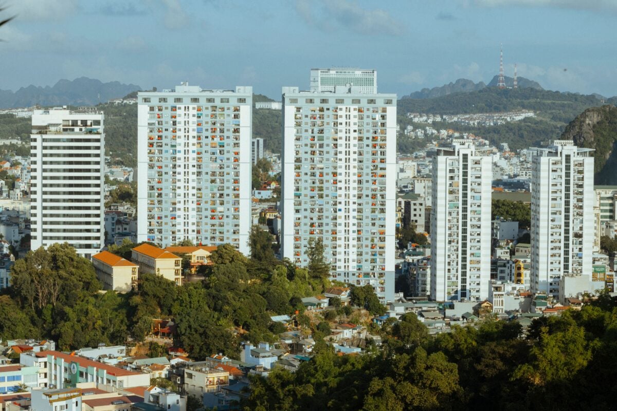pexels 19828765 | Two Scots Abroad Skyline view of Ha Long with modern high-rise apartment buildings and lush greenery.