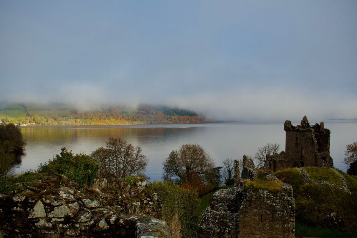 pexels 20035657 | Two Scots Abroad Explore the misty beauty of Urquhart Castle on the serene shore of Loch Ness in Scotland, a perfect autumn scene.