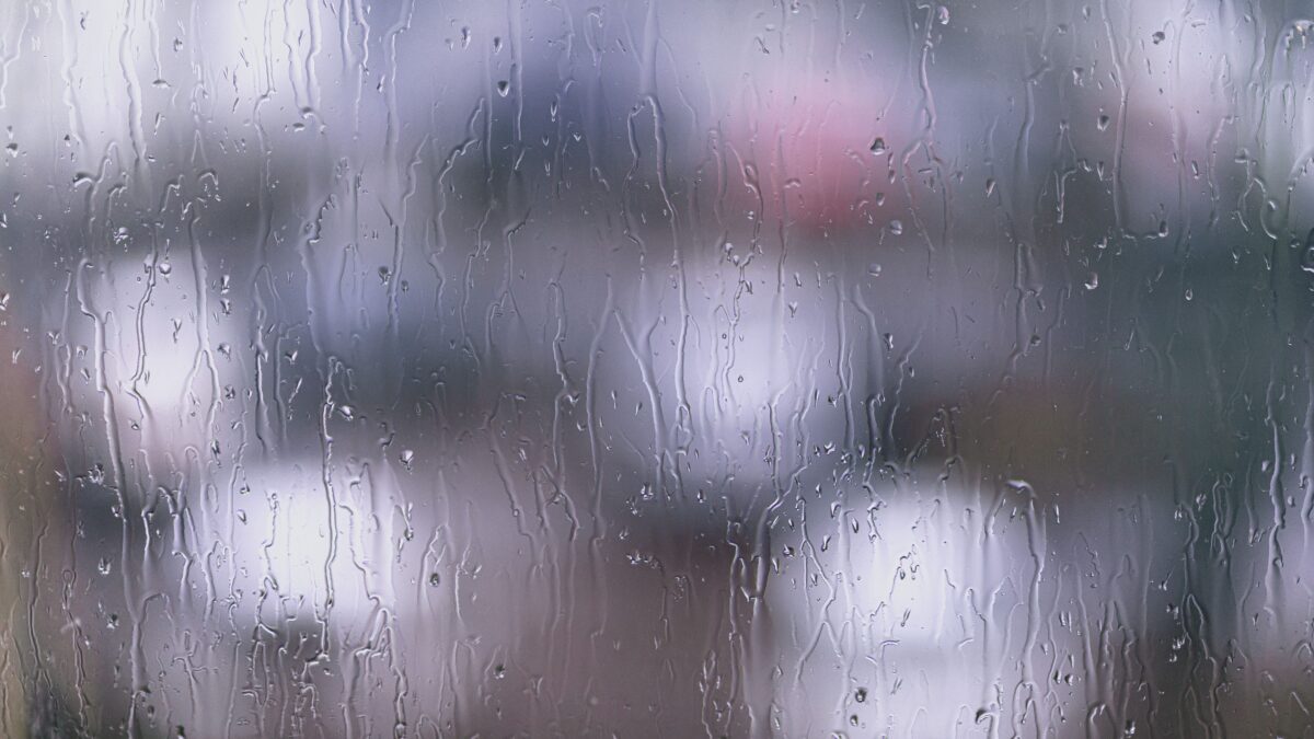 pexels 20105098 | Two Scots Abroad Blurred view of rain on a glass window, creating a moody aesthetic.