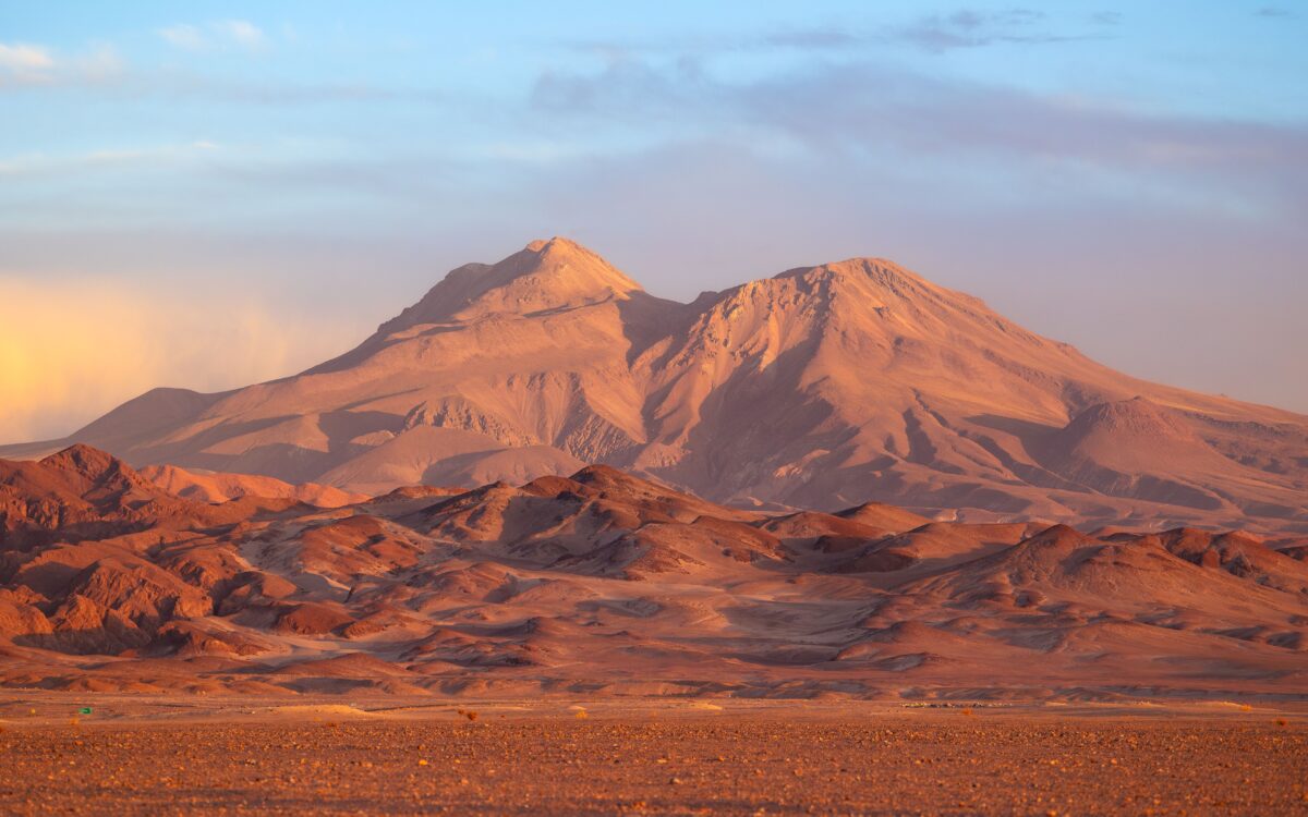 pexels 23886066 | Two Scots Abroad Breathtaking view of mountains in the Atacama Desert, Chile, during a vibrant sunset.