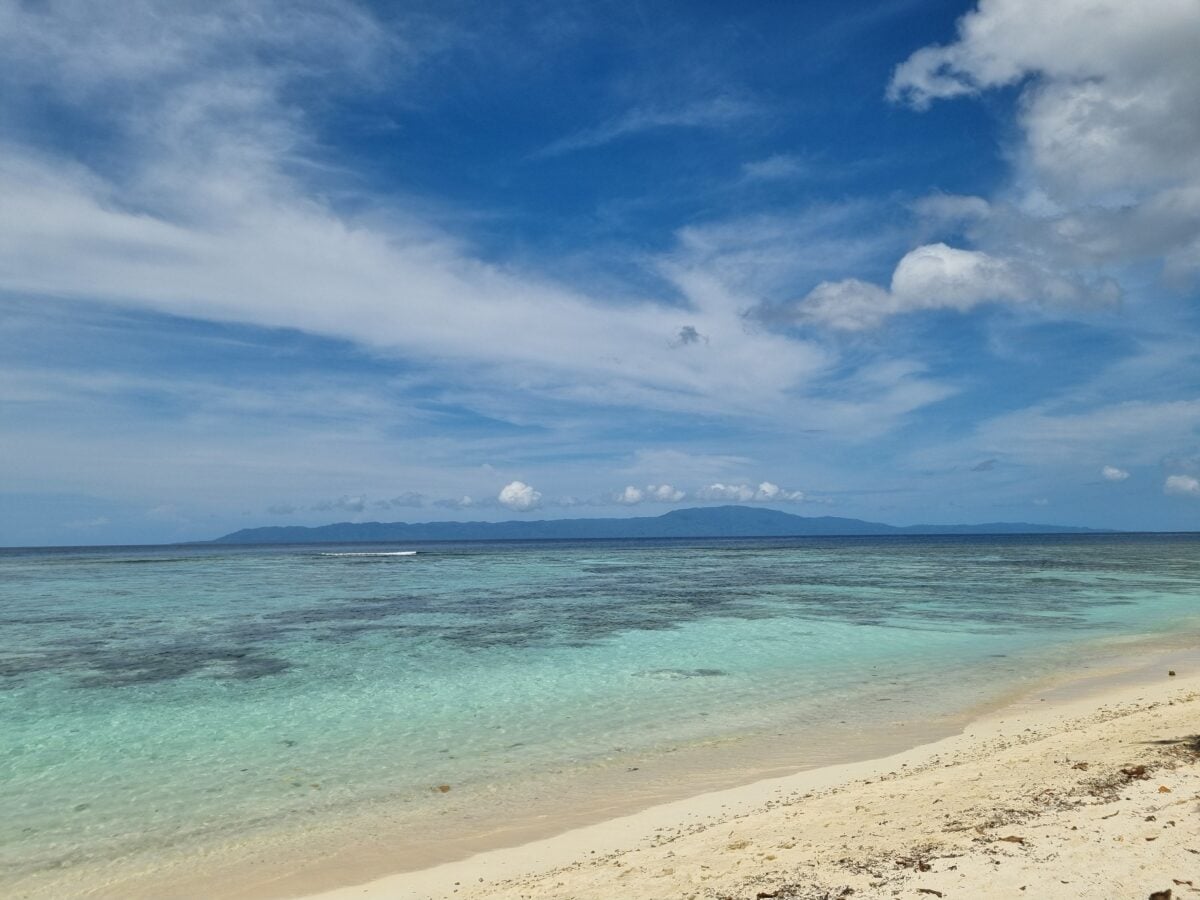 pexels 29643273 | Two Scots Abroad Explore the tranquil beach of Gizo, Solomon Islands with clear waters and sandy shores.
