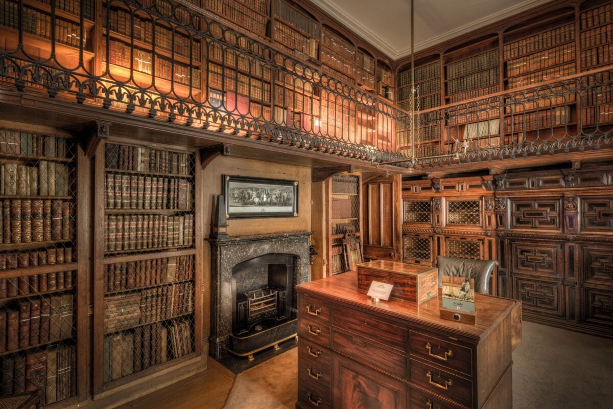 pexels 36093623 | Two Scots Abroad A historic library in Scotland featuring extensive wooden bookshelves filled with books.
