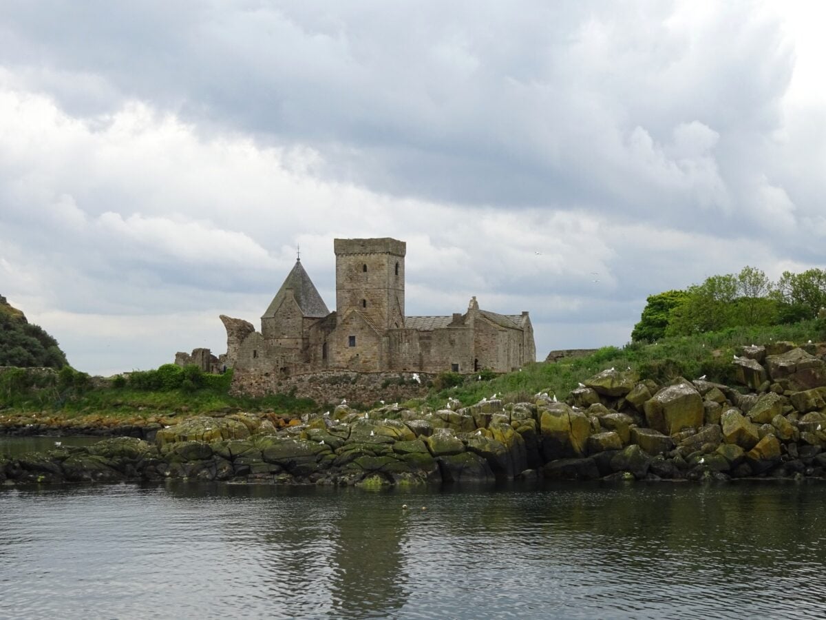 pexels 36650300 | Two Scots Abroad Explore the captivating ruins of Inchcolm Abbey set against a serene coastal backdrop in Scotland.