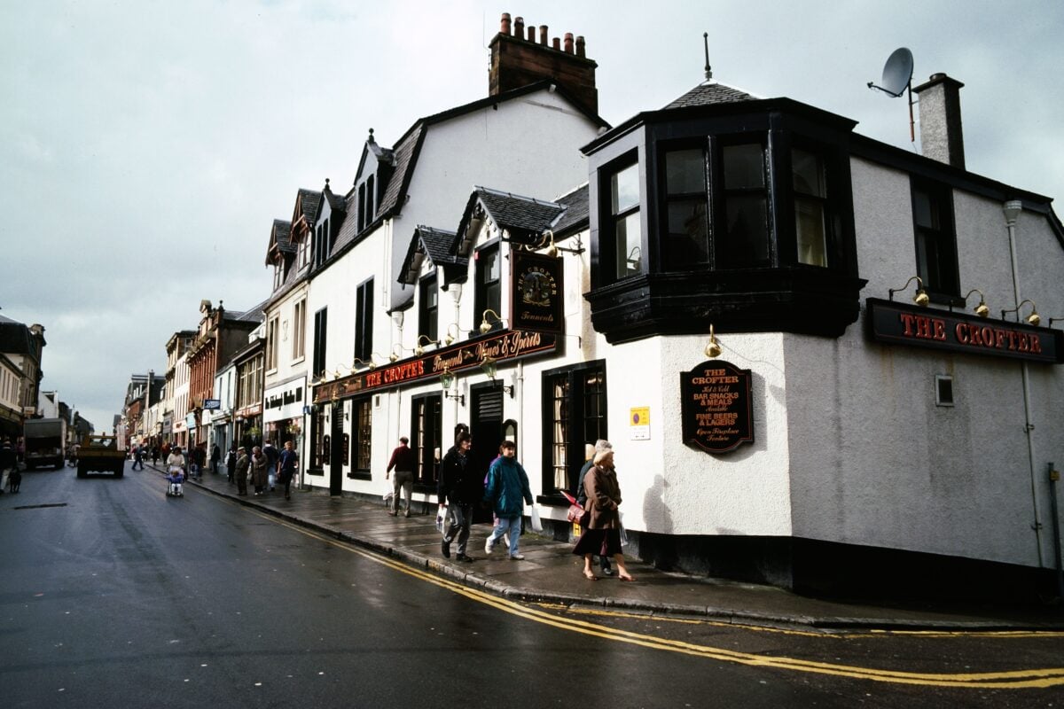 pexels 37177733 | Two Scots Abroad Busy street scene outside The Crofter in Scotland on a cloudy day.