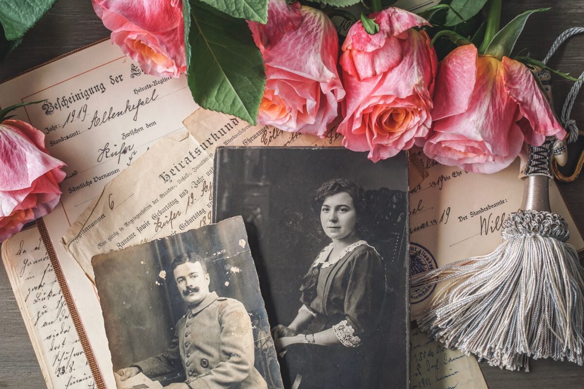 pexels 4394526 | Two Scots Abroad Antique family photographs with pink roses and historic documents.