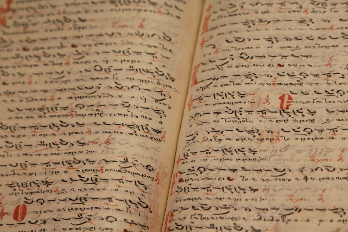pexels 5149241 | Two Scots Abroad From above of ancient opened book with handwritten inscriptions in black ink in Arabic language on thin pages