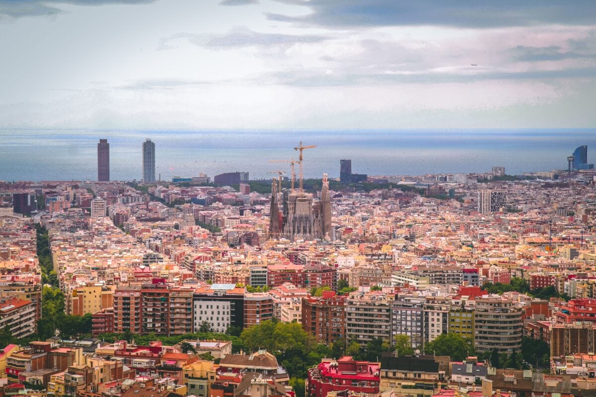 pexels 819767 | Two Scots Abroad A panoramic view of Barcelona city with Sagrada Familia and coastline in daylight.