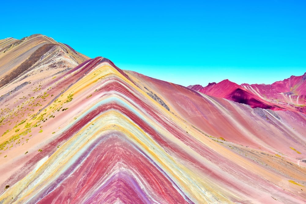 Perus Rainbow Mountain Hidden Under Ice Until 2013 shutterstock 2664892559 | 5 Adventure Bucket List Destinations for Your Next Big Trip