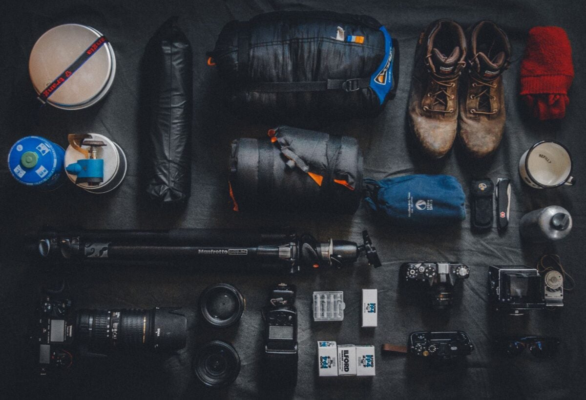 pexels 821750 | Two Scots Abroad Flat lay of outdoor camping and photography equipment neatly organized.