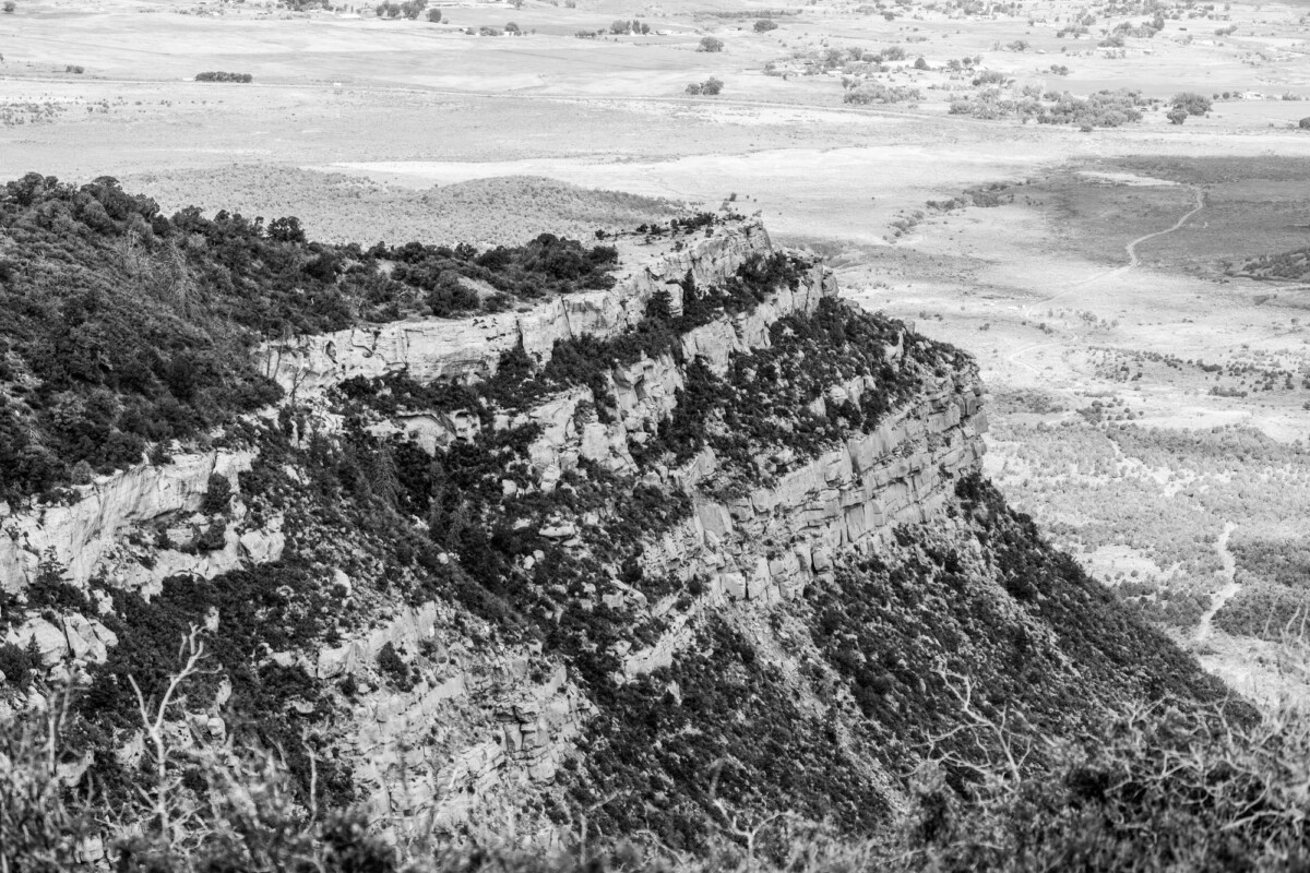 a dramatic black and white photograph of rocky cliffs near cortez colorado showc | Two Scots Abroad A dramatic black and white photograph of rocky cliffs near Cortez, Colorado, showcasing natural beauty.