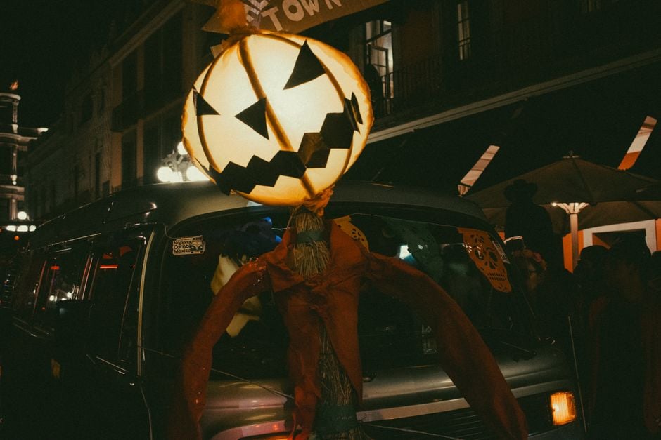 a giant pumpkin lantern decorates a street creating a spooky halloween ambiance | Two Scots Abroad A giant pumpkin lantern decorates a street, creating a spooky Halloween ambiance at night.