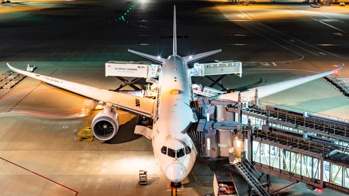aerial view of an airbus being boarded at night in tokyos bustling airport | Two Scots Abroad Aerial view of an Airbus being boarded at night in Tokyo's bustling airport.