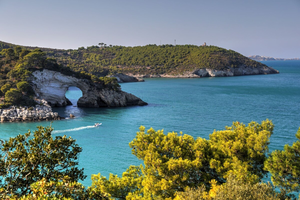 Breathtaking coastal arch and turquoise waters in Puglia, Italy's nature.