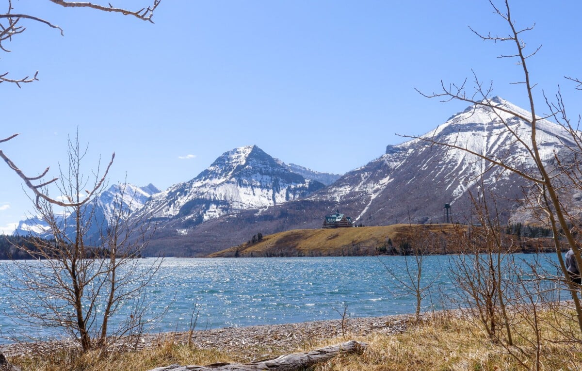 breathtaking view of waterton lake surrounded by majestic snow capped mountains | Two Scots Abroad Breathtaking view of Waterton Lake surrounded by majestic snow-capped mountains in spring.