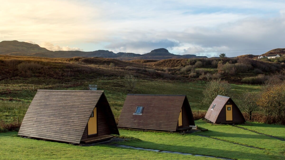 Cozy A-frame cabins on lush hills in Carbost, Isle of Skye. Perfect for nature enthusiasts.