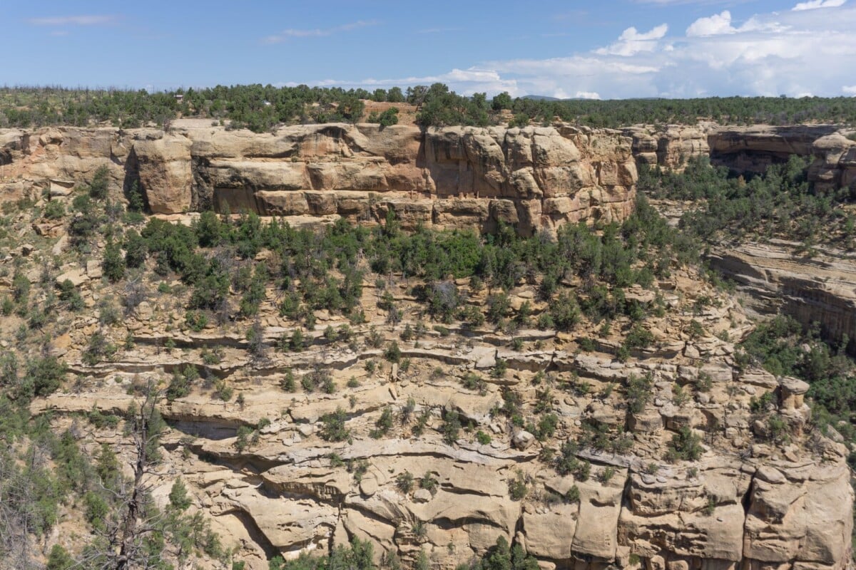 explore the rugged canyon landscape of mesa verde in cortez colorado showcasing | Two Scots Abroad Explore the rugged canyon landscape of Mesa Verde in Cortez, Colorado, showcasing stunning rock formations.