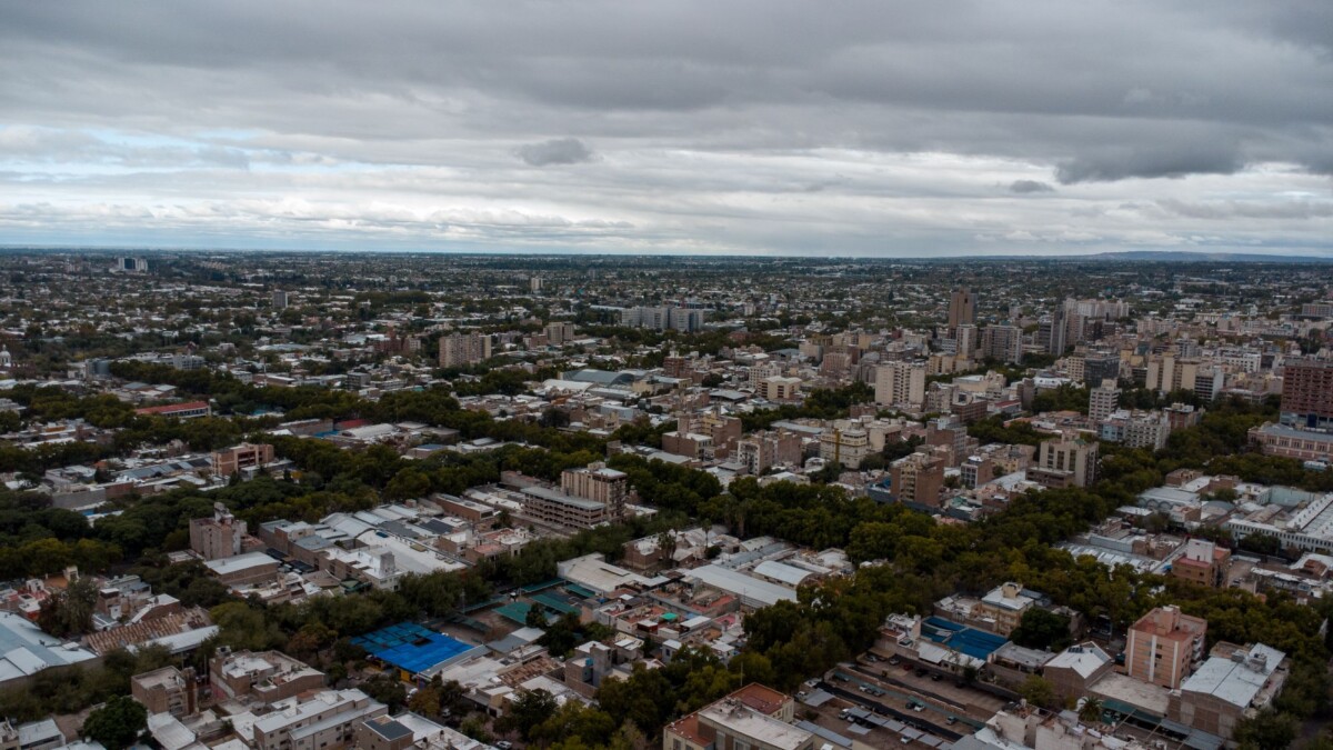explore the sprawling cityscape of mendoza argentina from above showcasing urban | Two Scots Abroad Explore the sprawling cityscape of Mendoza, Argentina from above, showcasing urban density and greenery.
