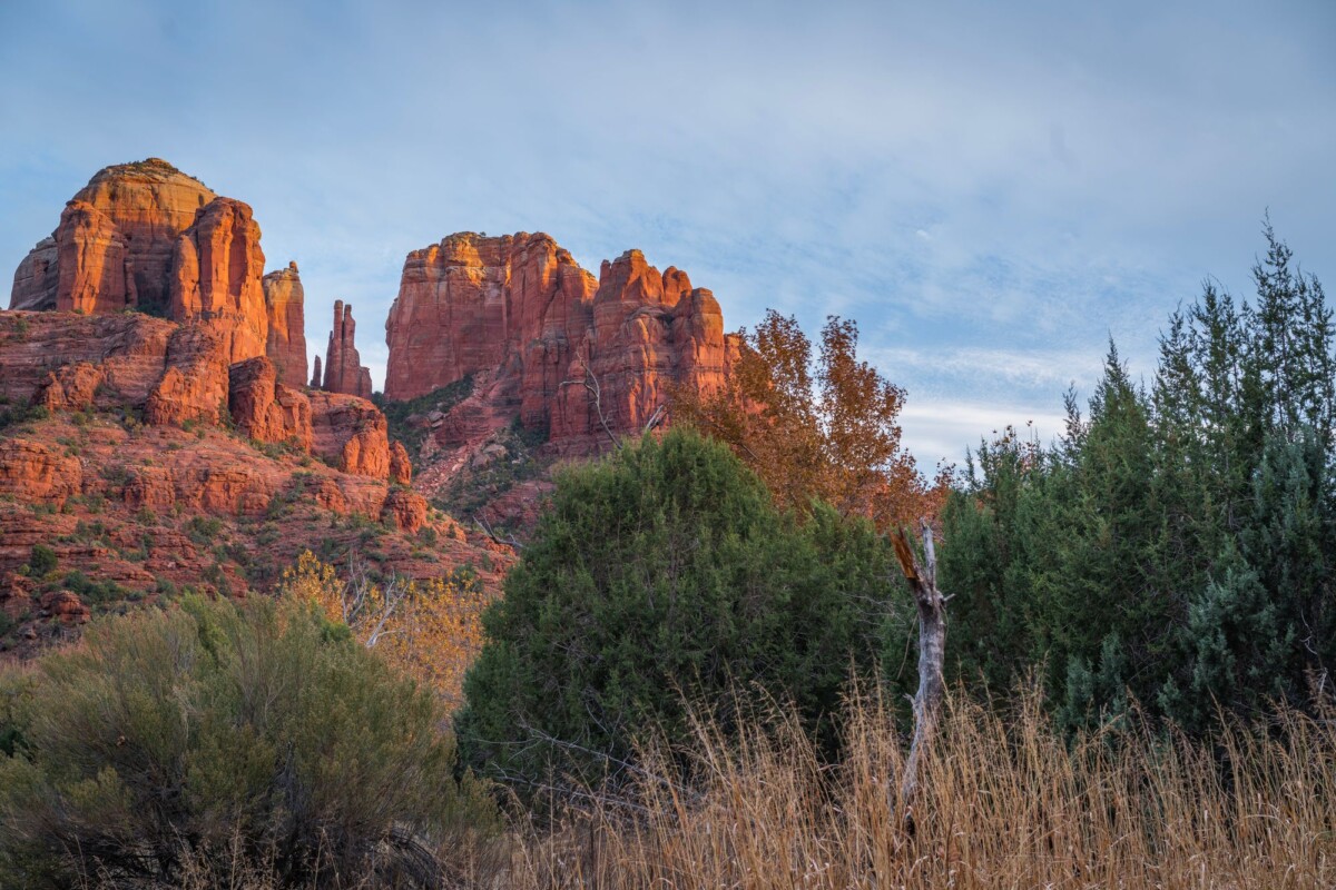 Explore the stunning red rock formations of Sedona, Arizona, under a clear blue sky.