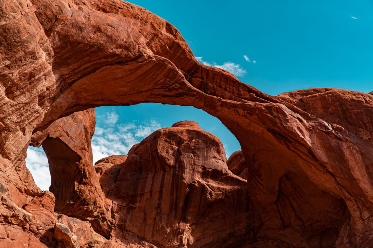 Majestic rock formations under a clear blue sky in Arches National Park, Utah.