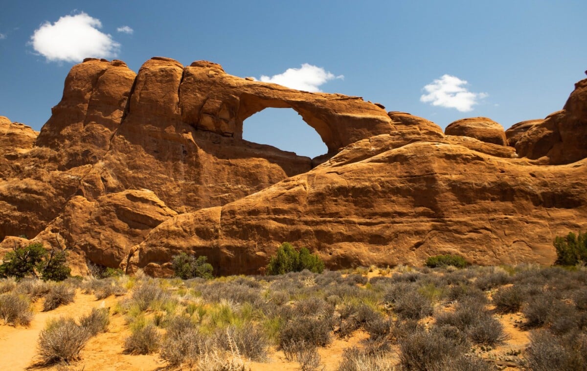 majestic view of skyline arch in arches national park utah showcasing natural ro | Two Scots Abroad Majestic view of Skyline Arch in Arches National Park, Utah, showcasing natural rock formations under a clear blue sky.