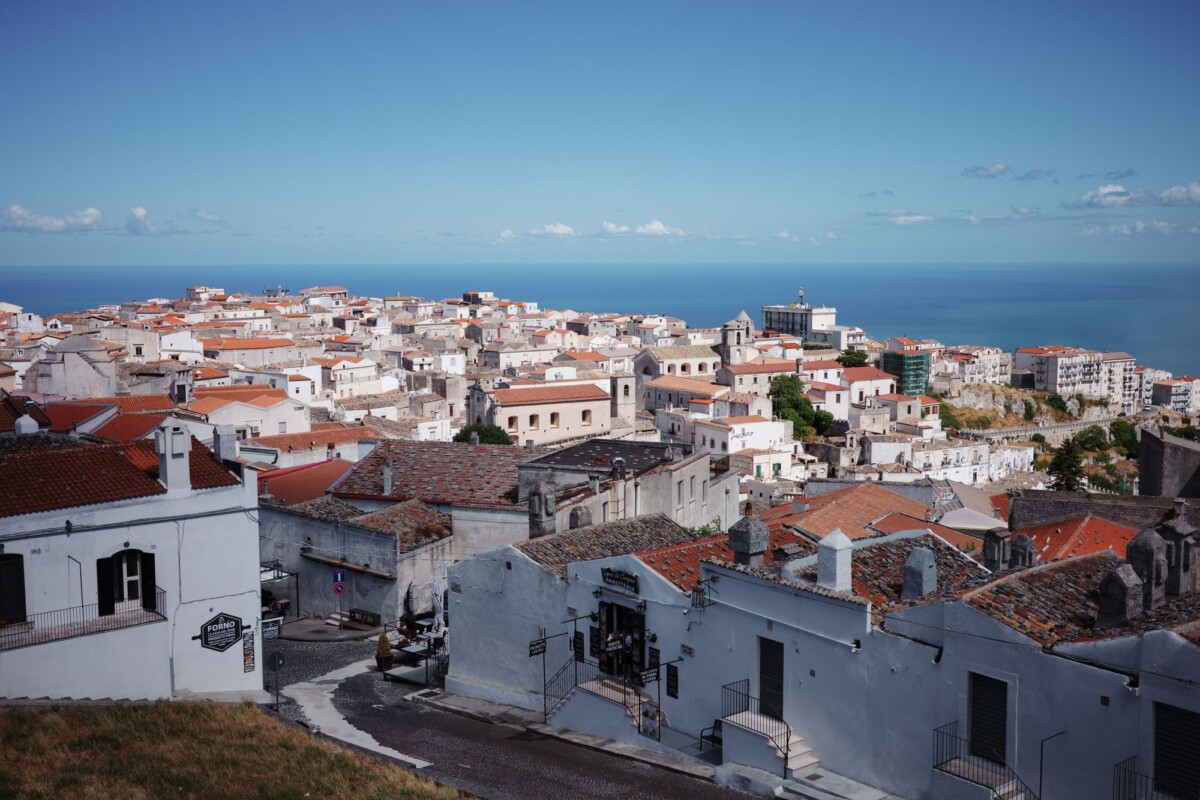 Picturesque view of Monte Sant'Angelo in Apulia, Italy with the sea in the background.