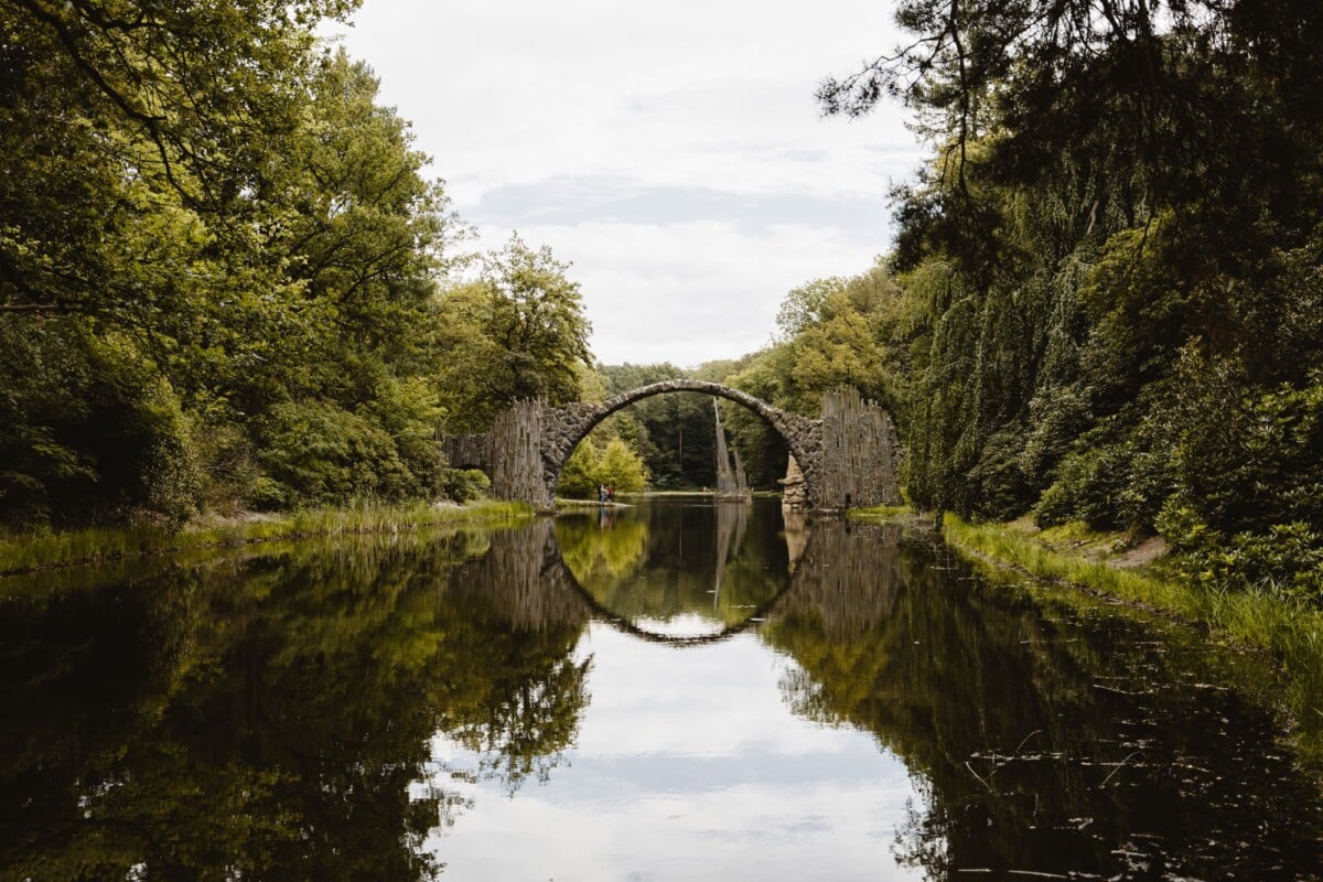 reflective view of rakotzbrucke a mystical stone bridge in kromlau park germany | Two Scots Abroad Reflective view of Rakotzbrücke, a mystical stone bridge in Kromlau Park, Germany.