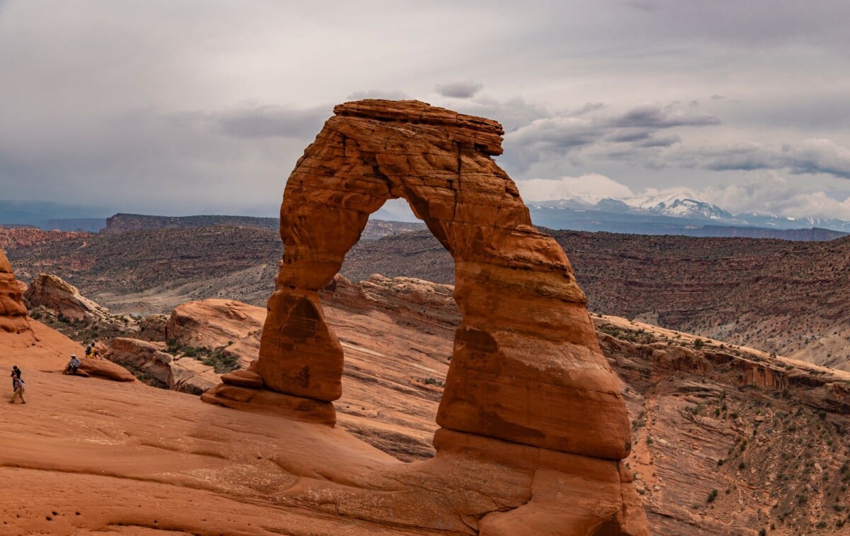 scenic view of the iconic delicate arch against a mountainous landscape in utah | Two Scots Abroad Scenic view of the iconic Delicate Arch against a mountainous landscape in Utah.