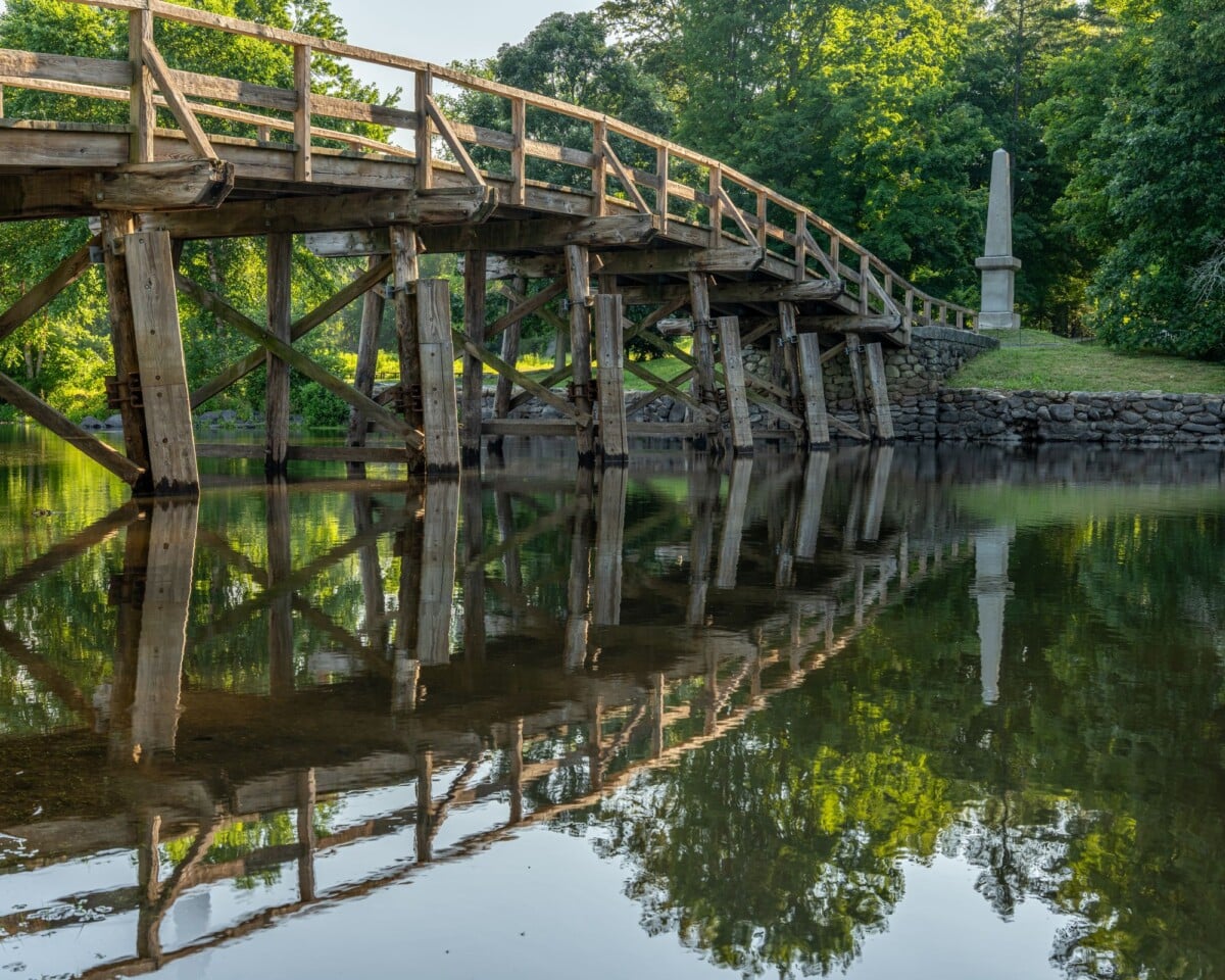 serene view of the old north bridge reflected in calm water at concord massachus | Two Scots Abroad Serene view of the Old North Bridge reflected in calm water at Concord, Massachusetts.