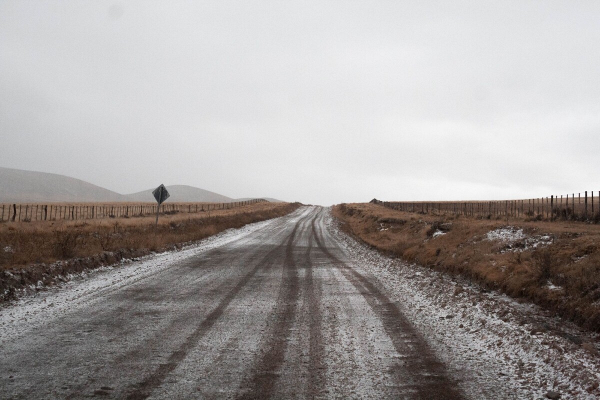 serene winter landscape of snow covered dirt road in tupungato argentina | Two Scots Abroad Serene winter landscape of snow-covered dirt road in Tupungato, Argentina.