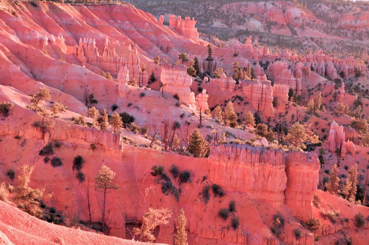 stunning sunrise over bryce canyons hoodoos showcasing vibrant unique rock forma | Two Scots Abroad Stunning sunrise over Bryce Canyon's hoodoos showcasing vibrant, unique rock formations in Utah, USA.