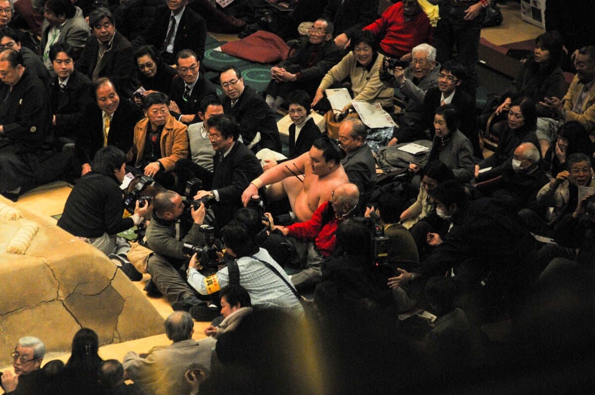 sumo wrestling event with photographers capturing the scene vibrant cultural mom | Two Scots Abroad Sumo wrestling event with photographers capturing the scene, vibrant cultural moment.