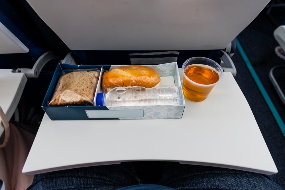 tray tables shutterstock 2673230571 | Two Scots Abroad tray tables shutterstock 2673230571 | Which Parts of an Airplane Are Dirtiest? The Cleanest Spots May Surprise You