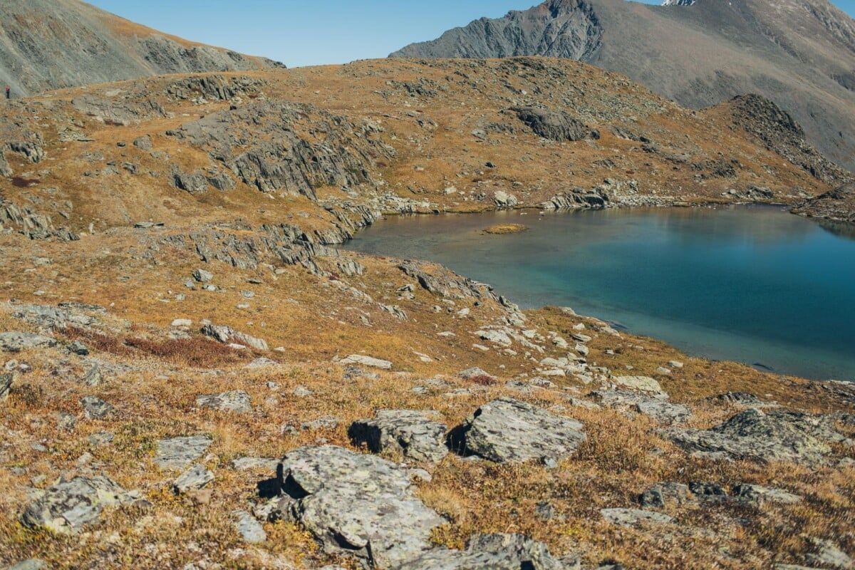 a serene mountain lake nestled in an arid rocky landscape perfect for nature lov | Two Scots Abroad A serene mountain lake nestled in an arid rocky landscape, perfect for nature lovers.
