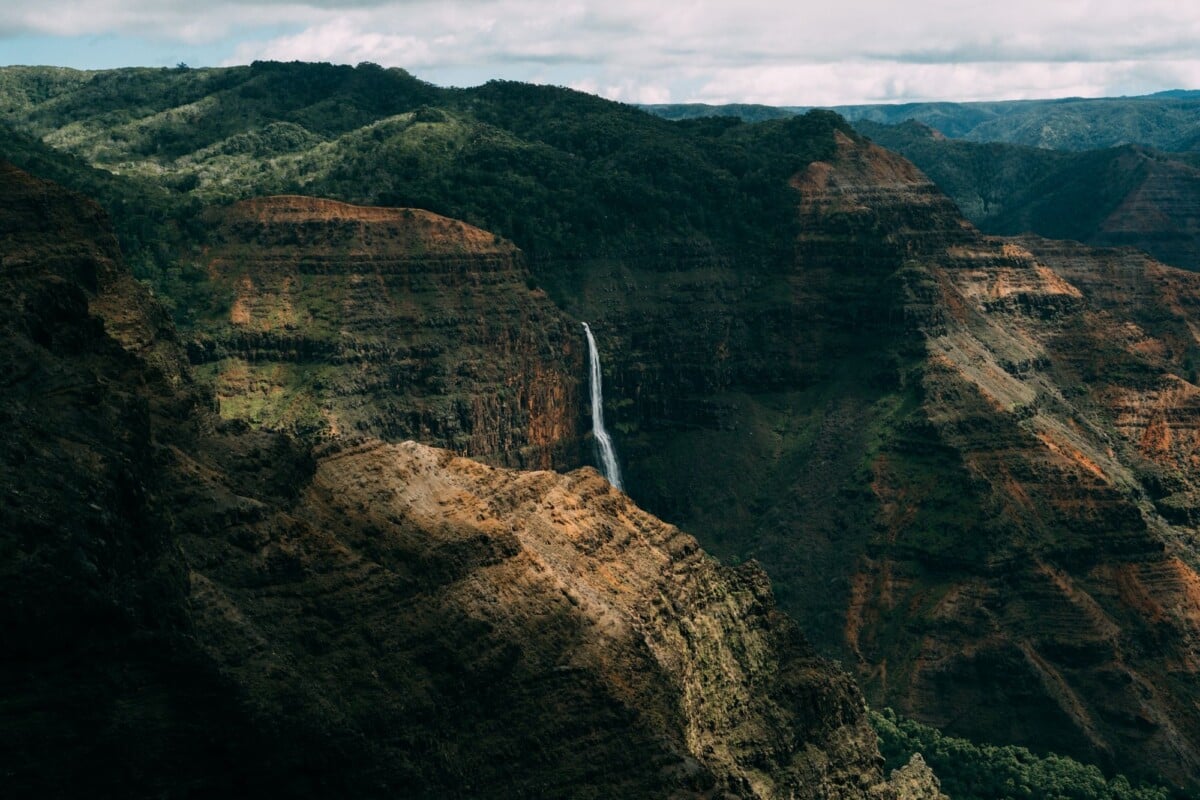 breathtaking view of waimea canyon with a stunning waterfall in the foreground s | Two Scots Abroad Breathtaking view of Waimea Canyon with a stunning waterfall in the foreground, showcasing the natural beauty of Hawaii.