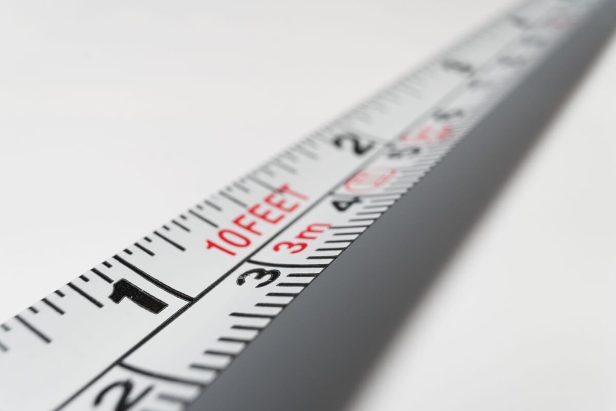 Detailed close-up of a measuring tape indicating measurements in feet and meters.