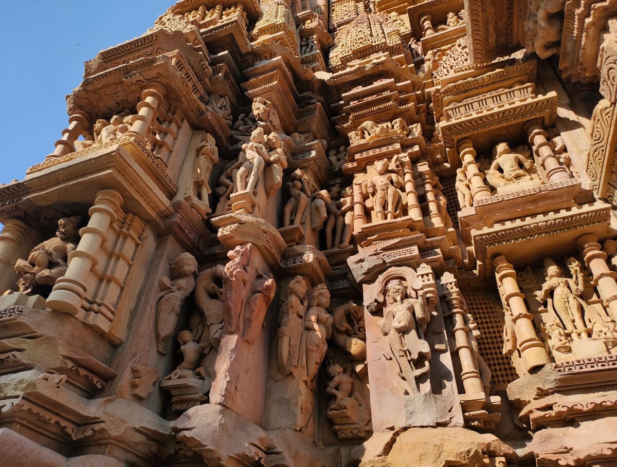 detailed stone carvings on a temple facade in khajuraho india showcasing ancient | Two Scots Abroad Detailed stone carvings on a temple facade in Khajuraho, India showcasing ancient Indian artistry.