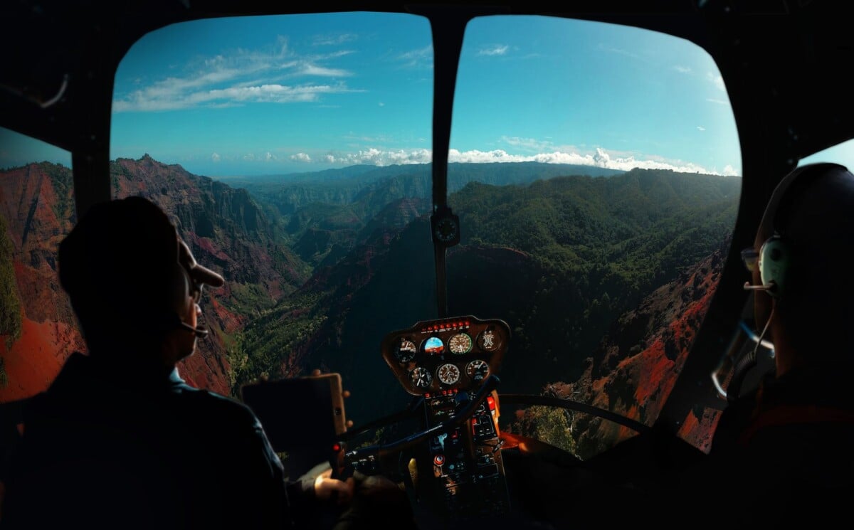 Experience breathtaking aerial views from a helicopter over Kauai's lush valleys and mountains.