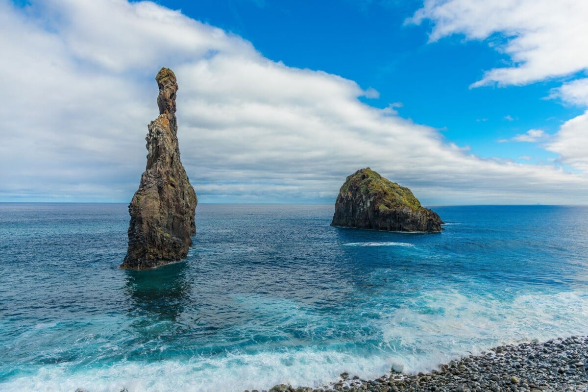 explore stunning rock formations at porto moniz madeira with vibrant blue ocean | Two Scots Abroad Explore stunning rock formations at Porto Moniz, Madeira with vibrant blue ocean views.